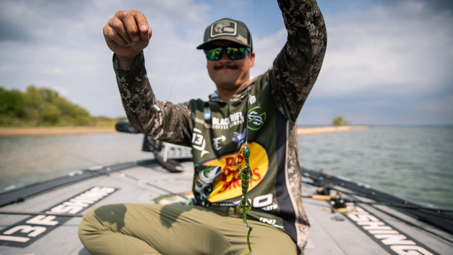 angler holding carolina rig with soft plastic bait for bass fishing