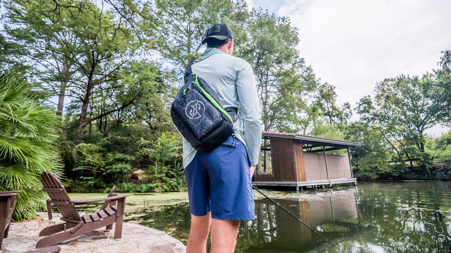 angler casting toward dock while bass fishing